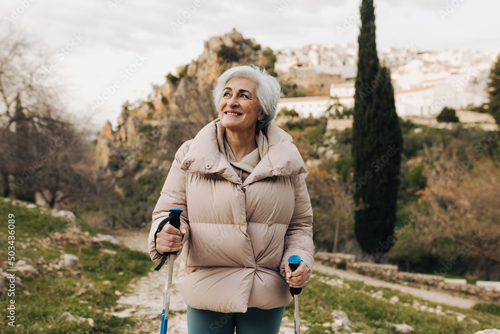 Older woman on a hike in nature.