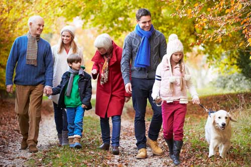 Grandparents walking with family