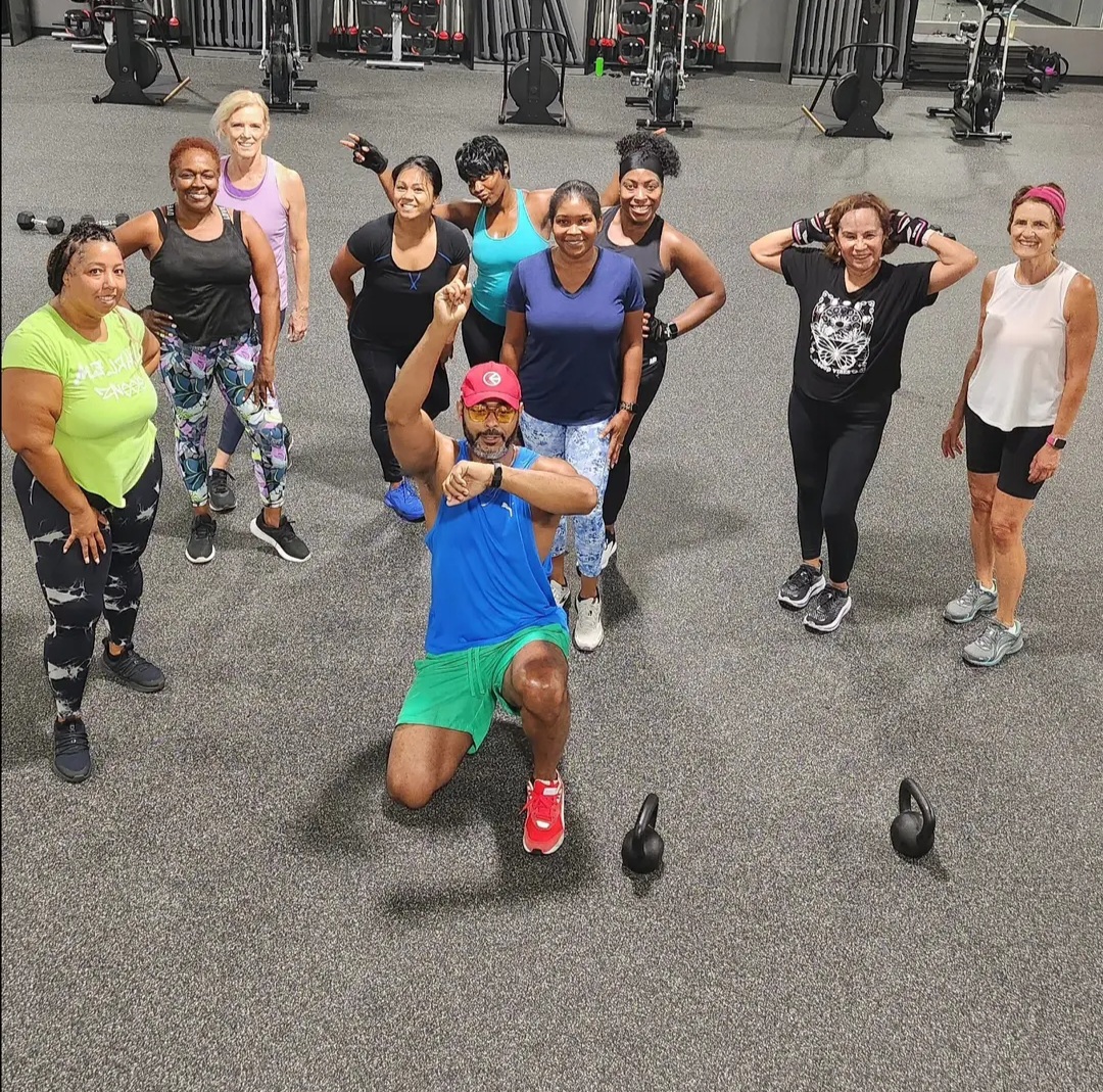 Picture of Scotch an ElderFIT personal trainer for seniors in Atlanta in a group class session surrounded by older females who just worked out.