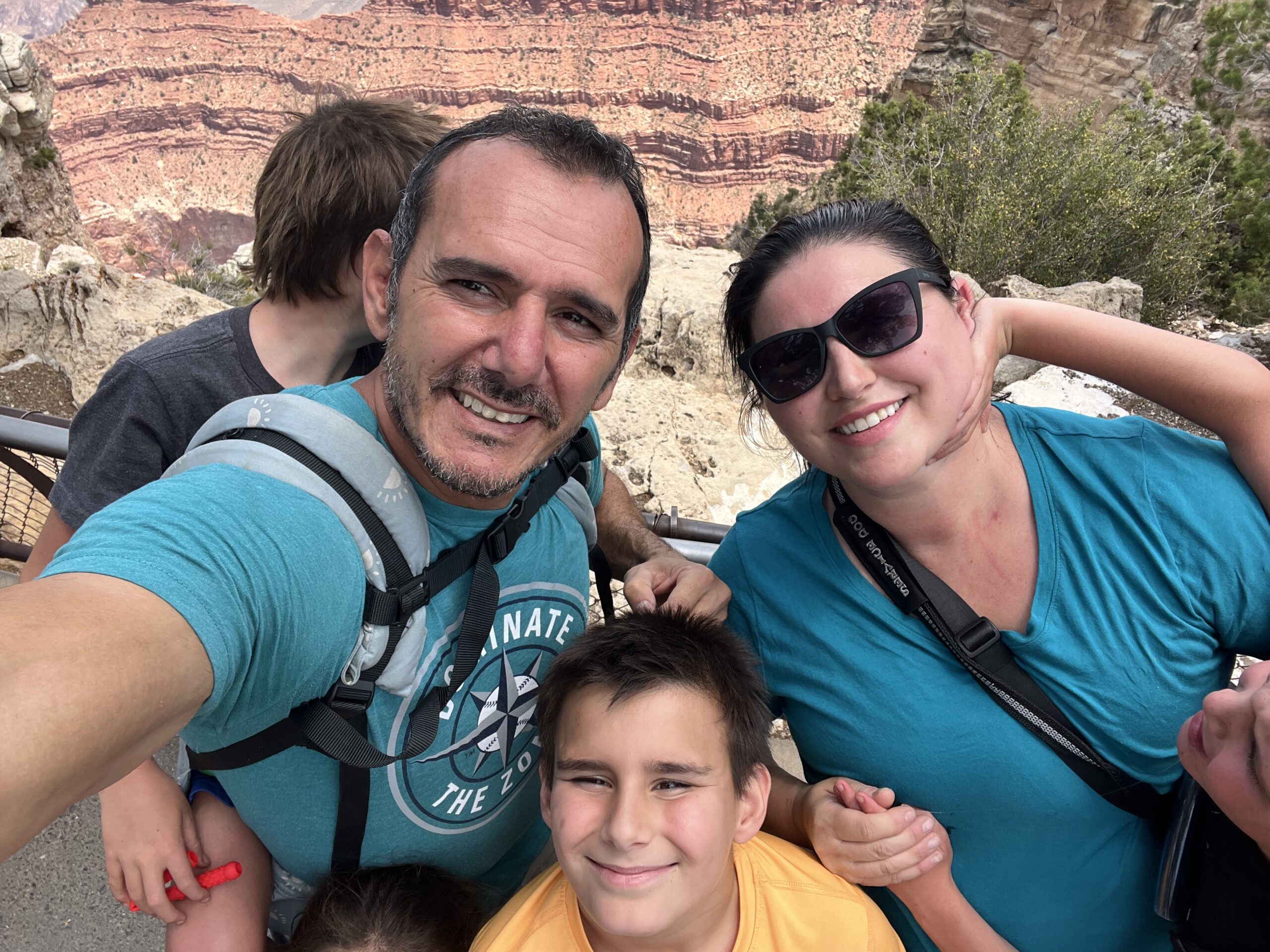 Picture of a top personal trainer for seniors in Gilbert, Yousef, posing with his family on a hike