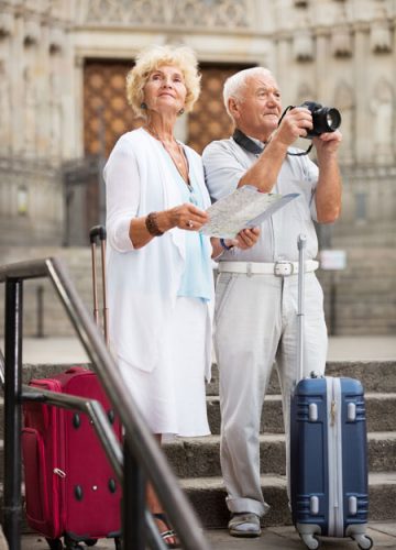 Elder couple on vacation taking photos